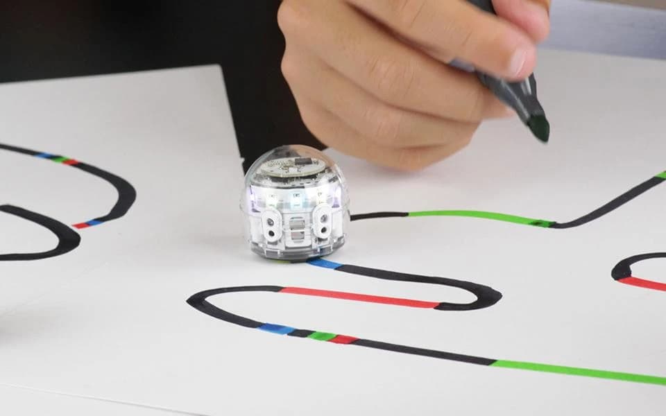 Small robot following colored lines drawn on paper